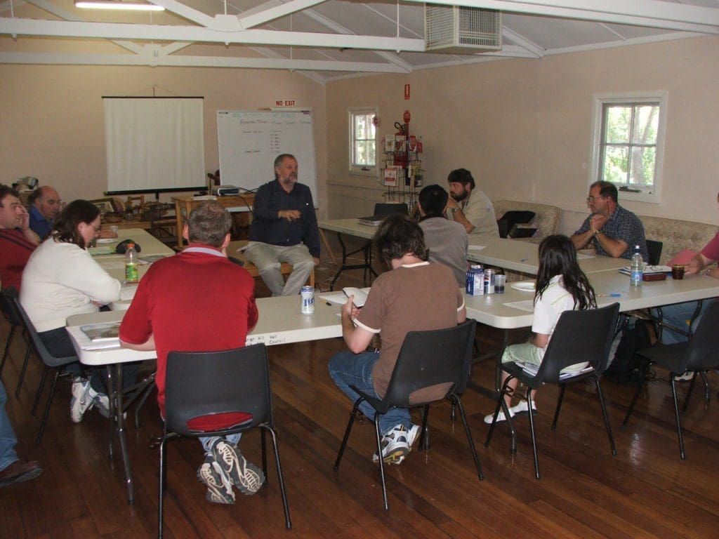 Presented teaching amateur radio class surrounded by students.